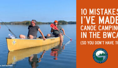 Two men sitting lazily in a canoe. Text: 10 Mistakes I've Made Canoe Camping in the BWCA