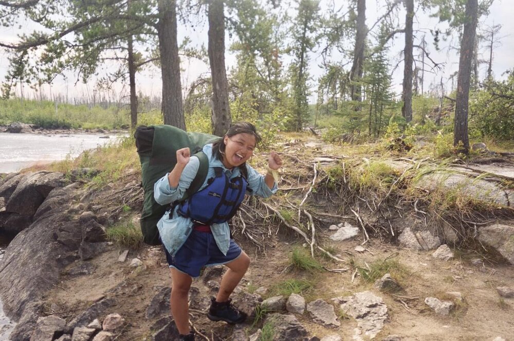 Lee Vue portaging with a pack in the BWCA