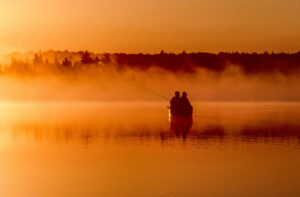 Image of two people in a canoe fishing the Boundary Waters
