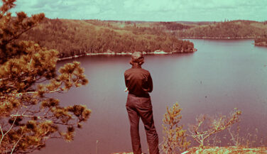 Vintage photo of a woman looking out over the Boundary Waters