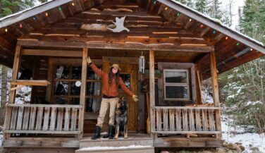 Ashley Bredemus on the porch of her cabin.
