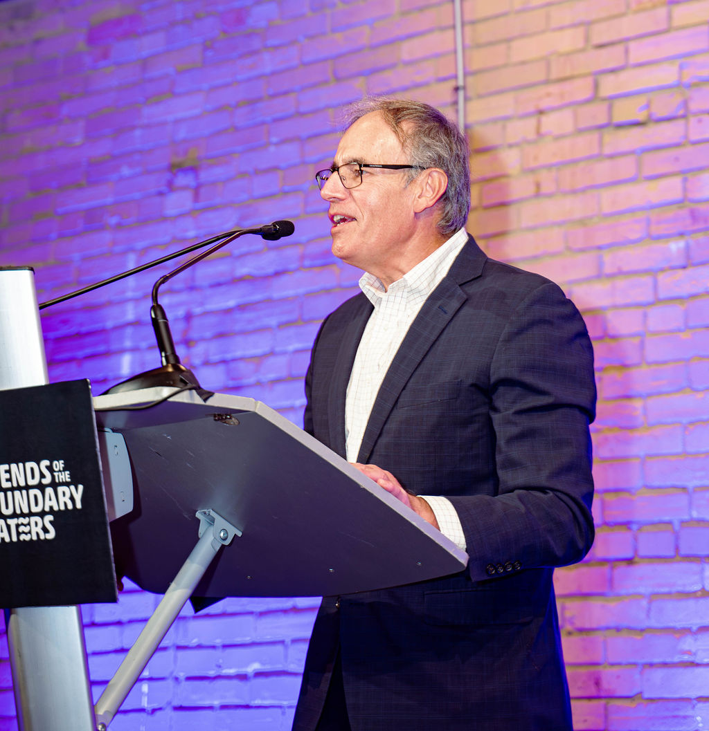 Friends' Executive Director Chris Knopf speaking at a podium