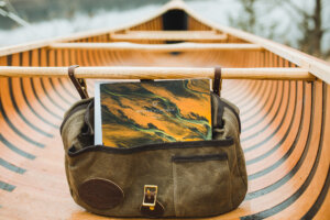 Frost River bag hanging from a canoe thwart