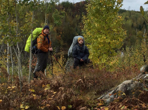 Two men hiking the Boundary Waters