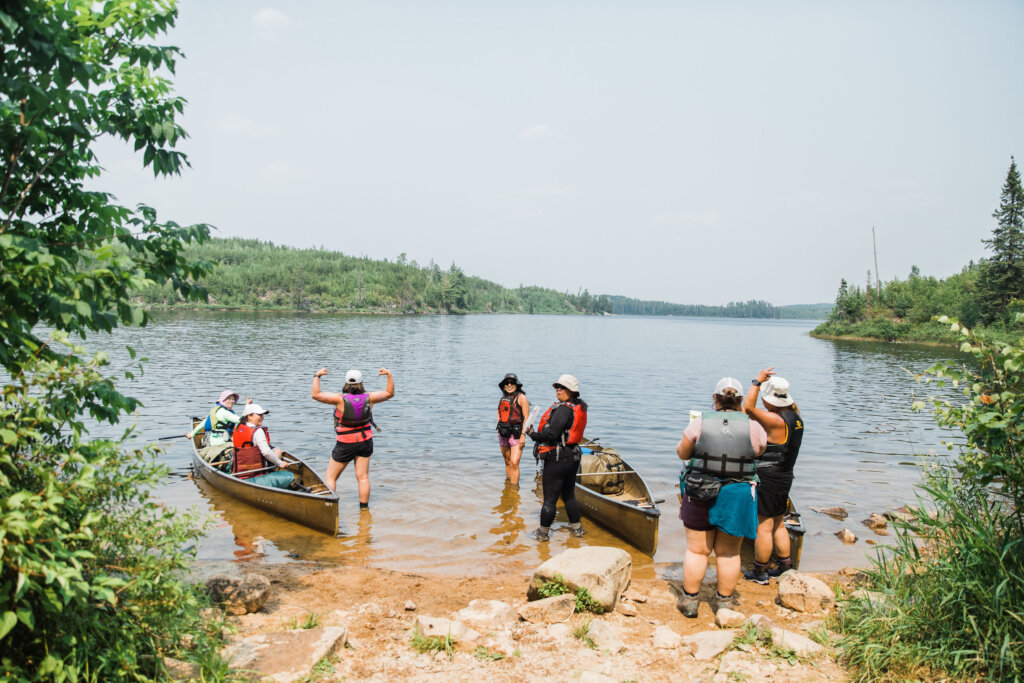 The Hmong women’s crew sets their sights on a new lake. From left, May Hang, MayKao Hang, Nou Yang, Pa Der Vang, Kaohly Her, Mai Nhia Xiong-Chan, Cate Thao. Photo by Lee Vue