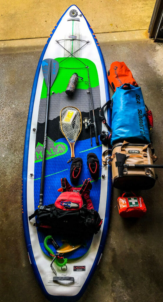 A stand up paddle board with all necessary gear.