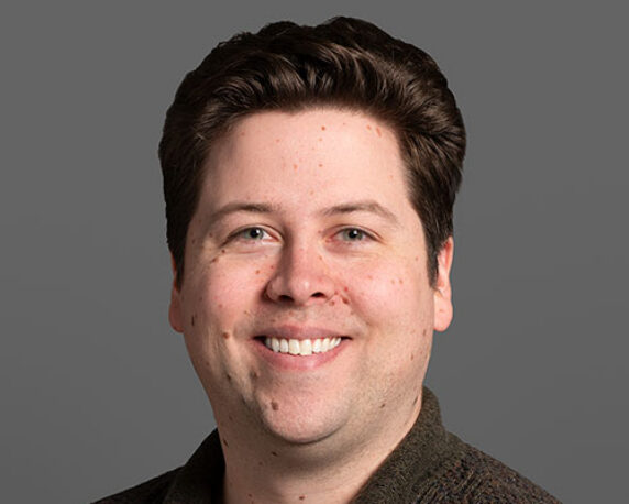 Headshot of Sam Reed
