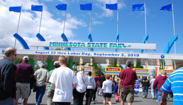 People streaming in through the gate of the MN State Fair