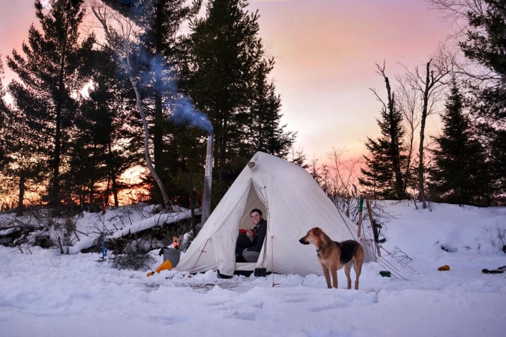 Winter camping in Boundary Waters with a hot tent Hot tent winter camping with dog in Minnesota