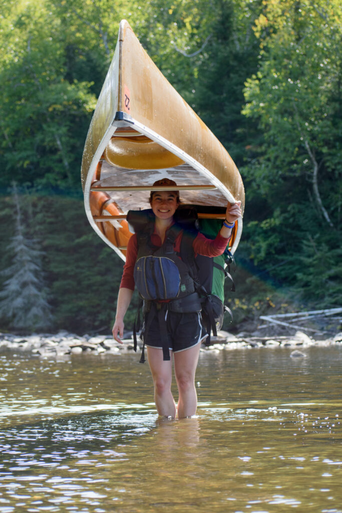 Women carrying a canoe in the Boundary Waters.