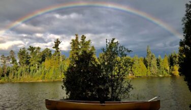 Rainbow over a kevlar canoe in the BWCAW