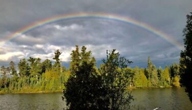 Rainbow over a kevlar canoe in the BWCAW