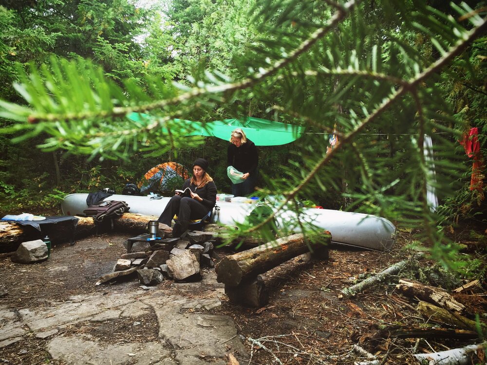 Boundary Waters Campsite with canoe backrest and table