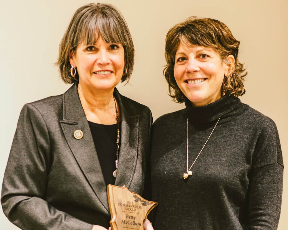 Representative Betty McCollum (left) receives Friends of the Boundary Waters Wilderness 2018 Conservation Award from Board Chair Margo Brownell.