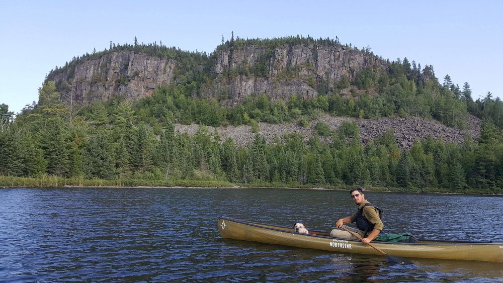 Eli Nord paddles on Mountain Lake