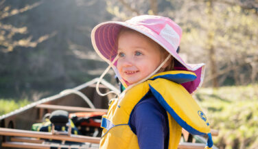 Smiling child in a canoe in the BWCA