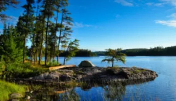 A canoe on a rock by a Boundary Waters lake